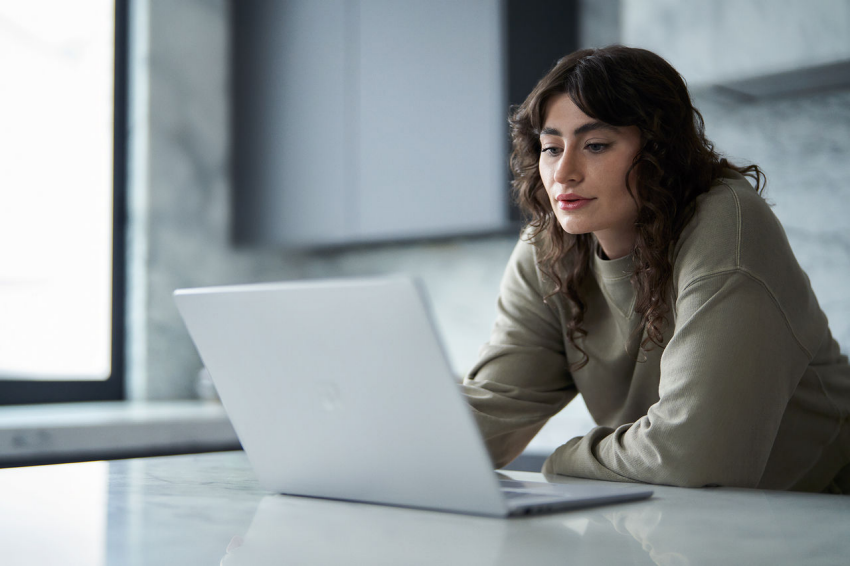 Woman staring at laptop