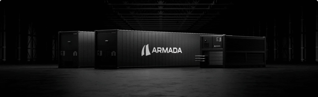 Armada Galleon modular datacenter units arranged in a row inside a dark industrial facility, with Armada branding visible on the central unit.